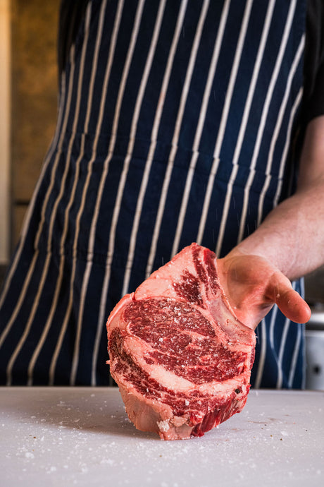 Thick-cut Kansas City strip steak, pasture-raised and dry-aged for bold, beefy flavor and tender texture.