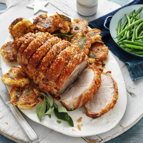 Heritage Berkshire pork chops with crackling sizzling on a dinner plate