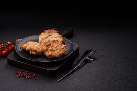 Heritage Berkshire pork chops from Brown Pearcy, pan-seared and served with a golden crust, showcasing premium farm-raised quality