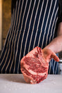 Thick-cut Kansas City strip steak, pasture-raised and dry-aged for bold, beefy flavor and tender texture.